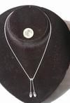 Collier avec pendentif massues en argent 